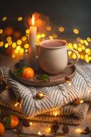 Steaming cup of hot beverage sits on a tray with a mandarin orange and lit candles, placed on a cozy knitted blanket with warm, inviting lighting, creating a perfect winter atmosphere photo