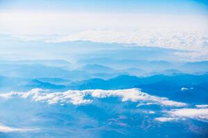A view of the planet Earth, a view from an airplane, mountains and clouds photo