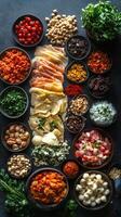 Colorful assortment of fresh dishes displayed on a dark table for a festive gathering in a vibrant kitchen photo