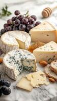 Assortment of Cheese, Grapes, Almonds, Bread, and Honeycomb on a Marble Surface photo
