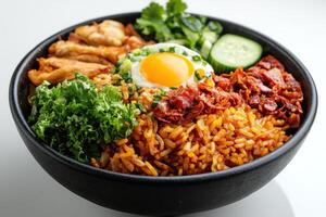A Bowl of Fried Rice with Toppings like Fried Egg, Bacon, and Cucumber photo