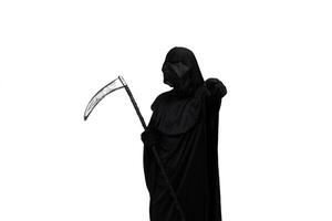 Grim reaper in Halloween costume holding scythe and pointing at the camera white background photo