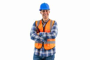 Engineer in blue helmet and orange reflective vest smiling with arms crossed white background photo