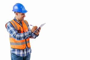 copyspace Engineer in reflective orange vest and safety helmet writing project notes in notebook photo