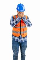 vertical Despondent construction worker covering his face with hands wearing orange vest and helmet photo