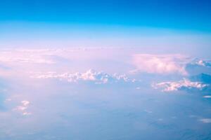 view of beautiful pink clouds in the sky, natural background, view from plane, top view photo