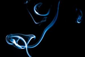 blue smoke, vapor, fog cloud on black background for using in composition and overlay photo
