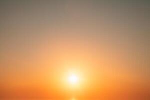 Natural delicate background, sky and sun at sunrise, color gradient from orange to blue, delicate and smooth transition photo