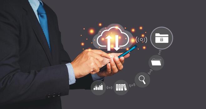 un empresario utilizando un teléfono inteligente iniciar sesión a nube informática en el virtual pantalla mientras en pie en un gris antecedentes foto