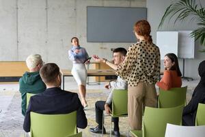 A diverse group of business professionals sits attentively in a modern office, actively participating in a training session led by an instructor, focusing on the latest technological advancements in photo