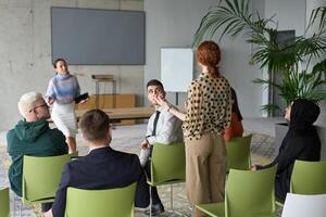 A diverse group of business professionals sits attentively in a modern office, actively participating in a training session led by an instructor, focusing on the latest technological advancements in photo