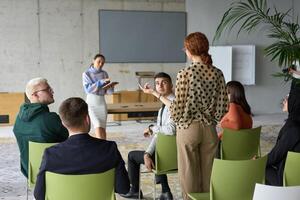 A diverse group of business professionals sits attentively in a modern office, actively participating in a training session led by an instructor, focusing on the latest technological advancements in photo