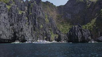 Lagoon with boats on the islands, Palawan, Philippines. Drone view video