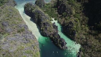 Drone flies over a big lagoon in El Nido video