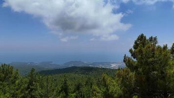 Drone Flying Over Mountain Forest with Sea and Clouds in Background video