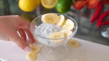 chia seeds yogurt add a fresh ripe banana, fresh pieces of banana that are used in the preparation of banana yogurt video