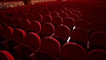 Kyiv, Ukraine, 29 May 2024 Rows of empty red velvet seats inside a theater or opera. No people in hall because of pandemic. Selective focus on opera interior. video