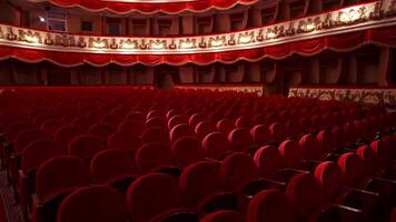 Kyiv, Ukraine, 29 May 2024 Empty classic theater. Rows of empty red velvet seats inside a theater or opera. No people in hall because of pandemic. Selective focus on opera interior. video
