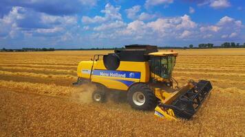 Kyiv, Ukraine, 29 May 2024 Harvester machine to harvest wheat field working. Combine harvester working on a wheat field. video