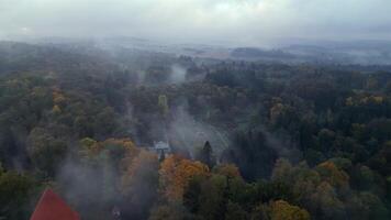 Aerial revealing view of foggy chateau Konopiste in Czechia in October 2024 video