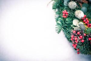 Christmas wreath isolated on a white snow background photo