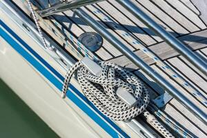 Mooring rope tied around a cleat photo