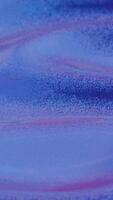 Abstract wave-like texture with purple and blue gradients in soft focus video