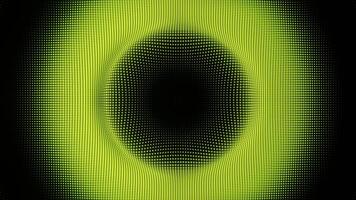 A green and black circular pattern on a black background video
