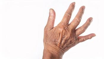 close-up of the back of an aged hand with prominent veins, deep wrinkles, and visible age spots on isolated white background photo