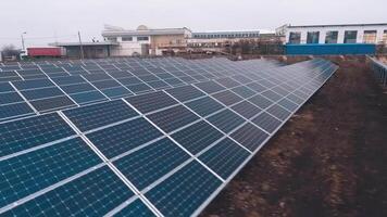 Modern sunny batteries on the field. Blue photovoltaic panels on a solar farm. Green alternative energy from the sun. video
