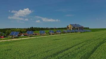 Photovoltaic solar panels on nature background. Blue sunny batteries along the road on green field. Sustainable source of clean energy. video