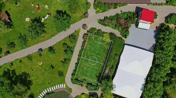 Green parks and playgrounds in recreation area. Modern resort area among nature in summer. Vacation center. Drone flight. video