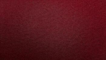close-up of deep red velvet-finished paper with fine texture and smooth tactile surface photo