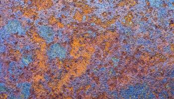 close-up of heat-treated steel with vibrant multi-colored oxidation patterns and textured surface photo