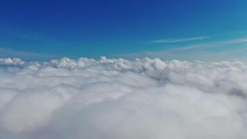 Blue sky and white clouds background. Stunning footage above clouds with blue sky. Travelling by air background. Real time footage. Aerial view. video