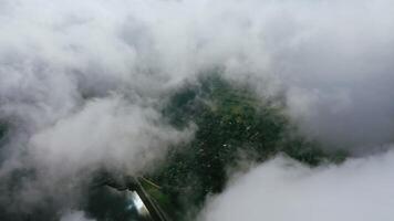 Light clouds moving in the sky. City view from the air through white clouds. Flying over the river and country. Aerial view. video