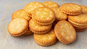 crispy round crackers stacked in a layered heap with golden texture and visible salt specks photo