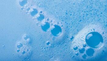 macro view of delicate blue cleanser foam with evenly sized micro-bubbles and smooth texture photo