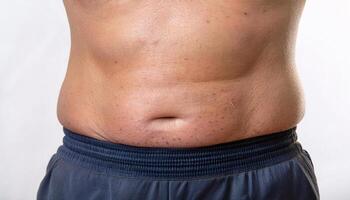Detailed shot of loose skin on the abdomen, showing age-related elasticity loss in isolated white background photo