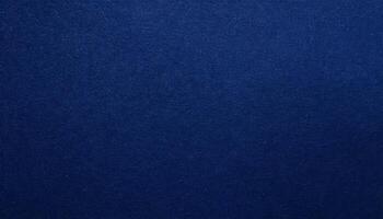 close-up of dark navy-blue textured paper with a smooth matte finish for premium backgrounds and graphic designs photo