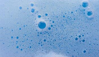close-up of blue foam with bubbly texture and intricate air bubble patterns photo
