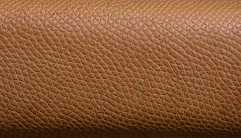macro view of basket-weave textured leather in tan color for fashion accessories and upholstery design photo