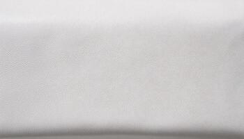 macro close-up of white leather surface with smooth flawless texture and detailed grain pattern photo