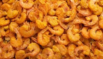 pile of crispy fried shrimp with golden texture and light batter coating arranged chaotically photo