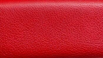 close-up of red leather texture with fine grain details and a glossy, reflective finish photo