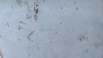Surface with scratches and marks in an outdoor environment during daylight photo