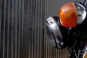 Vintage red motorcycle engine with chrome and metal details, featuring retro electric equipment and glass components, isolated with a toy-like appearance photo