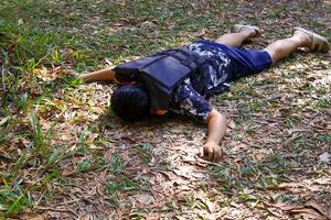 Tourists wearing life jackets were found lying face down on the grass, fainting or dying in the forest while hiking. photo