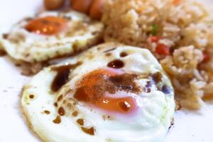 Closeup side view of fried egg with soy and pepper. photo