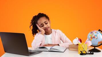 Education And Overworking Concept. Tired black female student studying at working table. Exhausted girl preparing for exams, reading paper book or her notes and falling asleep, resting head on hand photo